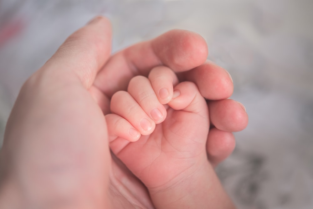 Holding Newborn Hand