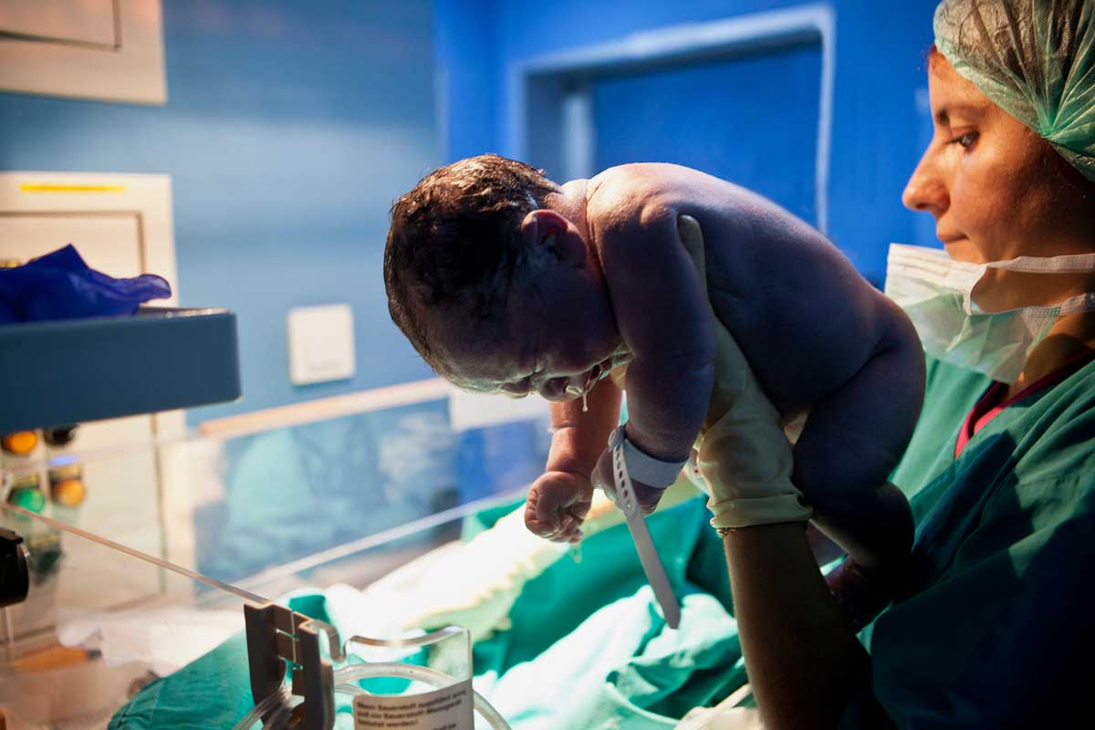 doctor holding baby