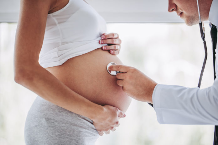 doctor with pregnant mother