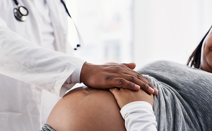 doctor monitoring mother